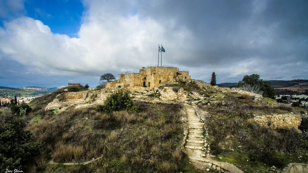 Stone steps leading up to the restored fort on the Castel hilltop, with flags flying