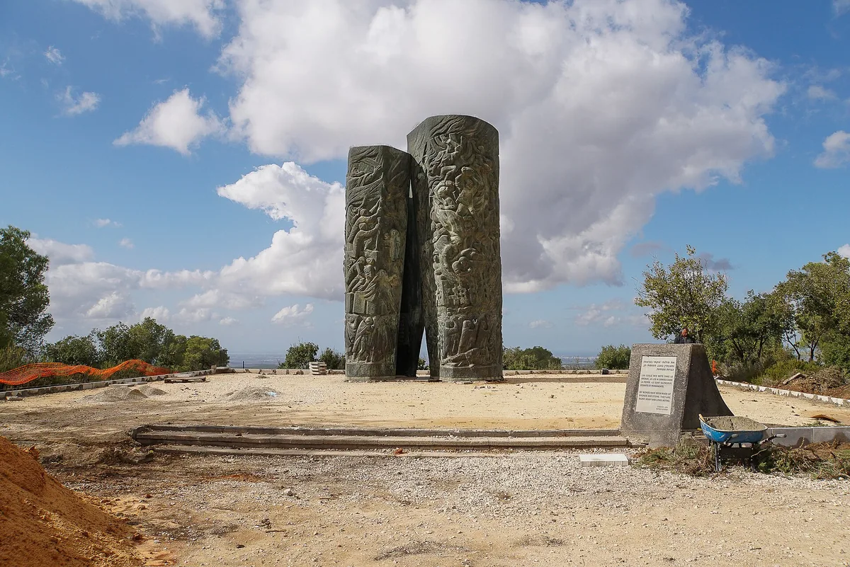 The Scroll of Fire, two tall bronze scroll-shaped columns covered in relief figures, in the Martyrs' Forest